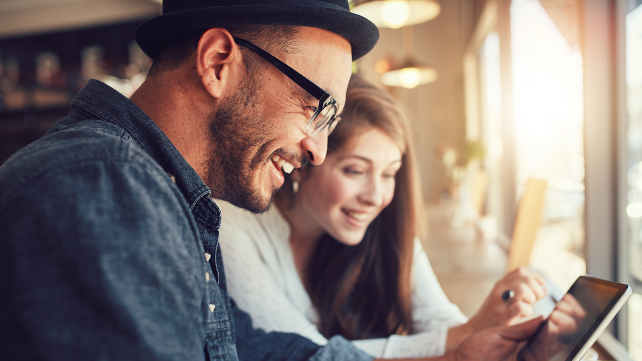 Couple on tablet in restaurant