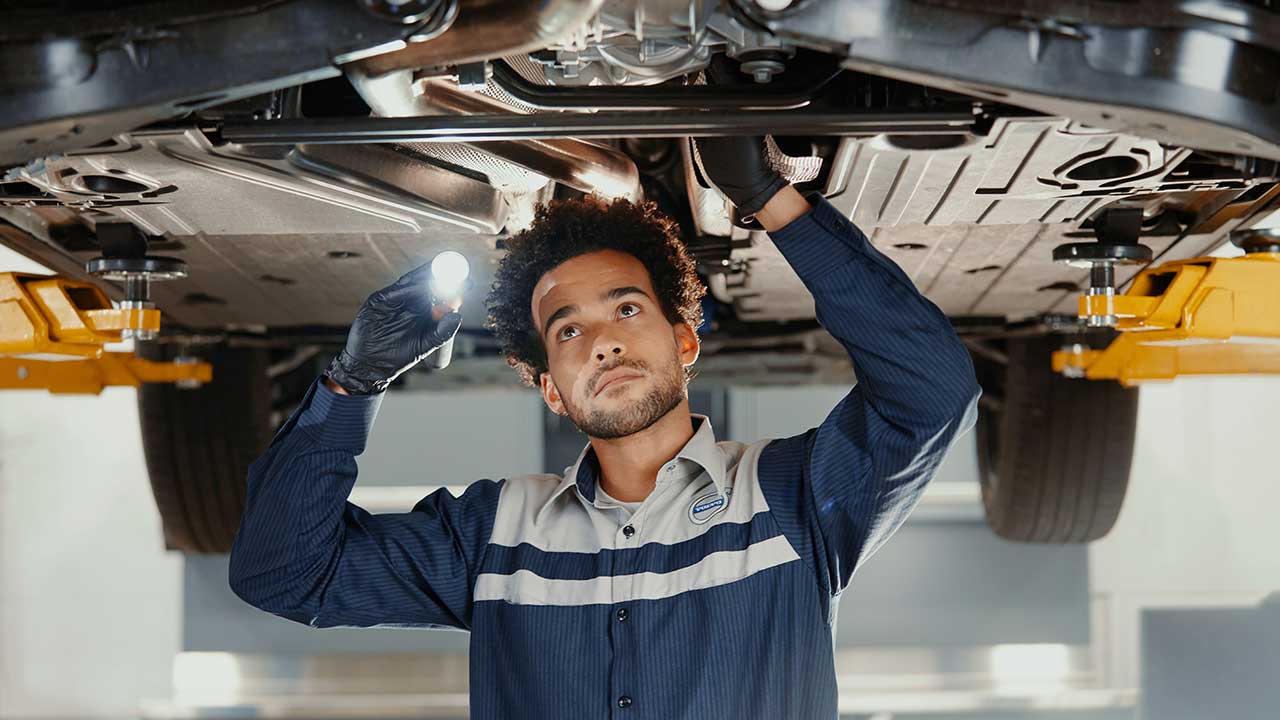 Mechanic under a volvo